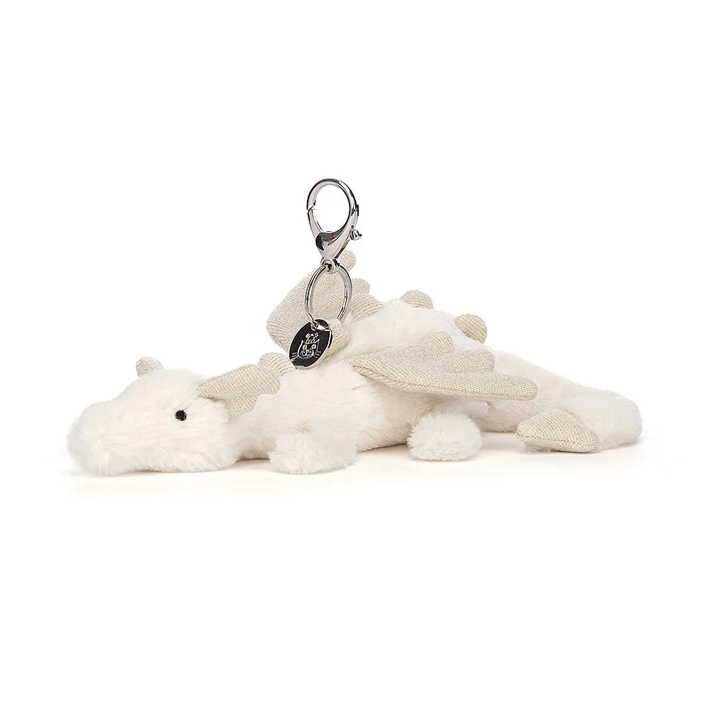 Soft and charming Jellycat designsJELLYCAT SNOW DRAGON BAG CHARM CREAM & GLITTER 12X8X22 CM Soft and charming Jellycat designsJELLYCAT SNOW DRAGON BAG CHARM CREAM & GLITTER 12X8X22 CM
