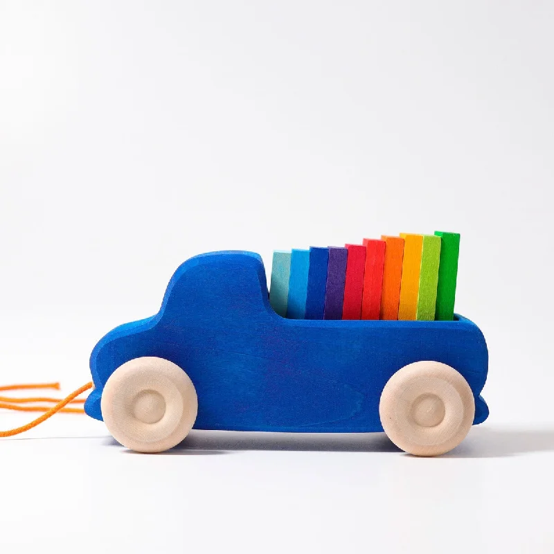 age-appropriate wooden toys                   Grimm's blue truck pull toy with blocks